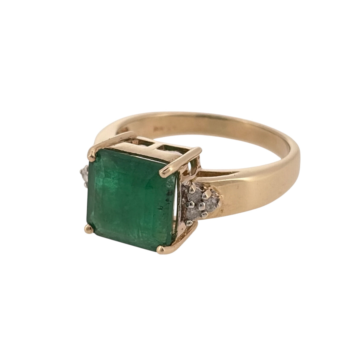 Add a colourful piece to your jewellery collection with this pre-owned 9ct yellow gold diamond and emerald ring, featuring a striking square emerald complemented by six small diamonds.

Design: The ring features a large square emerald at its centre, with three small diamonds set on either side, creating an elegant and balanced design.
Material: Made from 9ct yellow gold, offering a warm gold finish that complements the green emerald and diamonds.