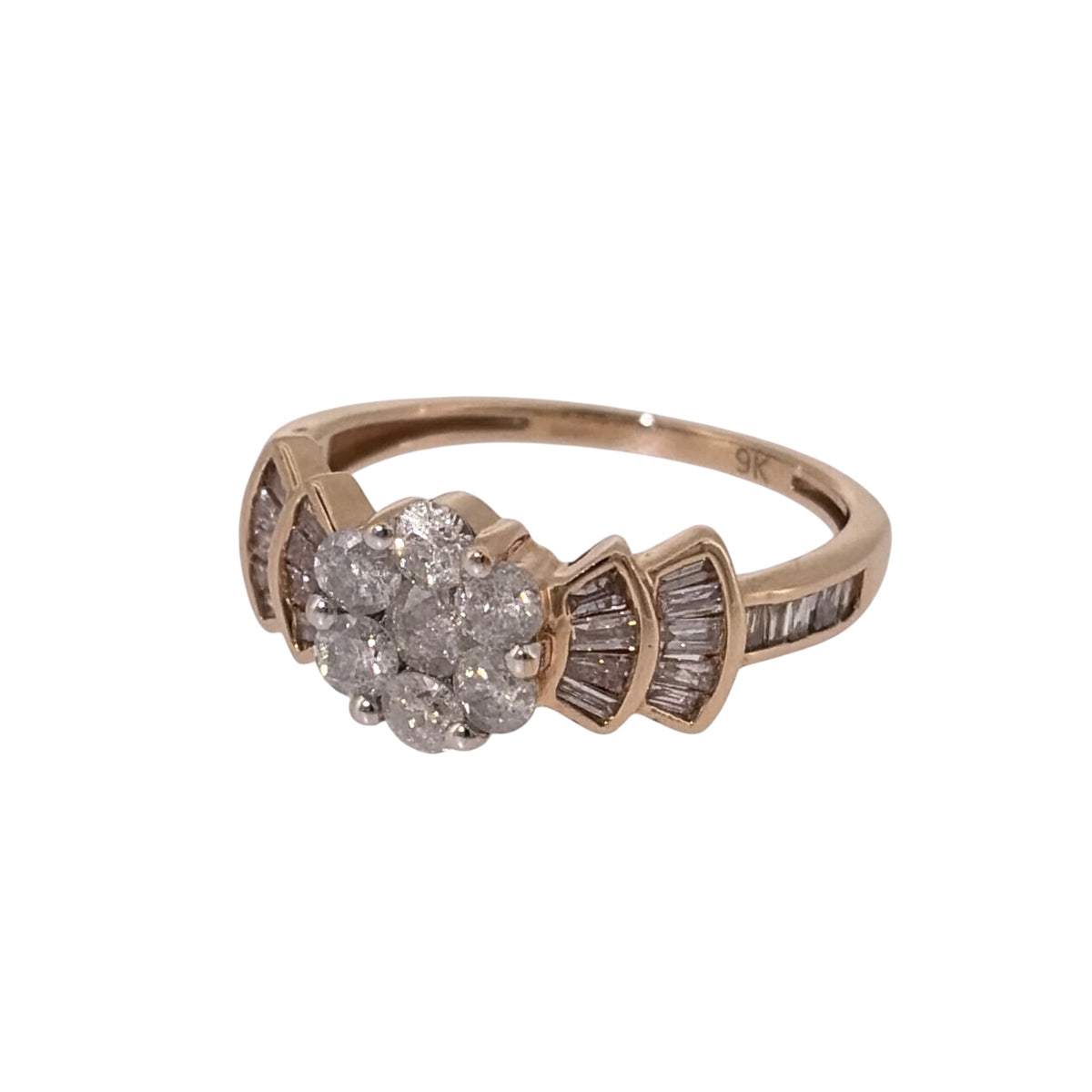 Add a distinctive piece to your jewellery collection with this pre-owned 9ct yellow gold and diamond flower cluster ring, featuring a combination of brilliant cut and baguette cut diamonds with a total estimated weight of 1.06ct.

Design: The ring features a flower-style central cluster of brilliant cut diamonds, complemented by three rows of baguette cut diamonds on either side, creating an elegant and decorative appearance.