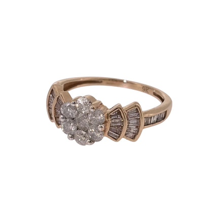 Add a distinctive piece to your jewellery collection with this pre-owned 9ct yellow gold and diamond flower cluster ring, featuring a combination of brilliant cut and baguette cut diamonds with a total estimated weight of 1.06ct.

Design: The ring features a flower-style central cluster of brilliant cut diamonds, complemented by three rows of baguette cut diamonds on either side, creating an elegant and decorative appearance.