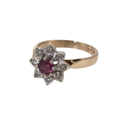 Add a classic piece to your jewellery collection with this pre-owned 9ct yellow gold diamond and ruby cluster ring, featuring a beautiful round ruby surrounded by diamonds.

Design: The ring features a traditional cluster design, with a central ruby surrounded by diamonds, creating an elegant and timeless appearance.
Material: Made from 9ct yellow gold, offering a warm gold finish that complements the ruby and diamonds.