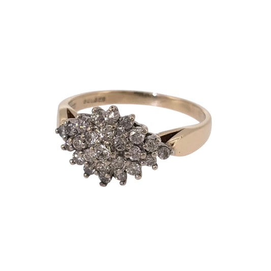 Add a classic piece to your jewellery collection with this pre-owned 9ct yellow gold and diamond cluster ring, featuring a decorative diamond-set front.

Design: The ring features a traditional cluster design, with multiple diamonds arranged together to create an elegant and timeless appearance.
Material: Made from 9ct yellow gold, offering a warm gold finish that complements the diamonds.
Diamond Detail: Features a cluster of diamonds set across the front of the ring, adding an attractive finishing touch.