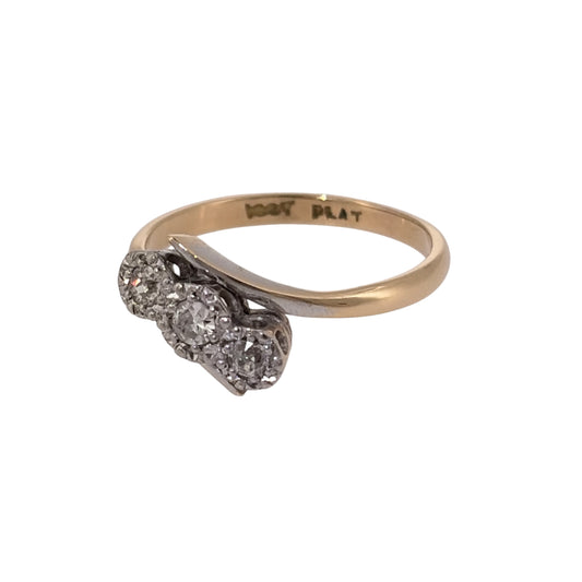 Add an elegant piece to your jewellery collection with this pre-owned 18ct yellow gold and platinum diamond trilogy twist ring, featuring three diamonds with a combined estimated weight of 0.15ct.

Design: The ring features a classic trilogy design with a decorative twist, combining three diamonds with flowing curves to create a timeless and elegant appearance.
Material: Made from 18ct yellow gold and platinum, combining the warm tones of yellow gold with the naturally white finish of platinum.