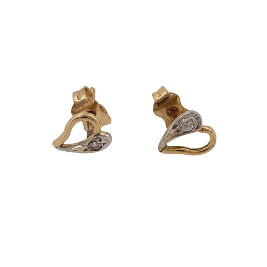 Add a charming piece to your jewellery collection with these pre-owned 18ct yellow and white gold cubic zirconia heart stud earrings, featuring a delicate two-tone gold design.

Design: The earrings feature a classic heart-shaped design, combining yellow and white gold with cubic zirconia detailing for an elegant and timeless appearance.
Material: Made from 18ct yellow and white gold, creating a beautiful contrast between the two gold tones.