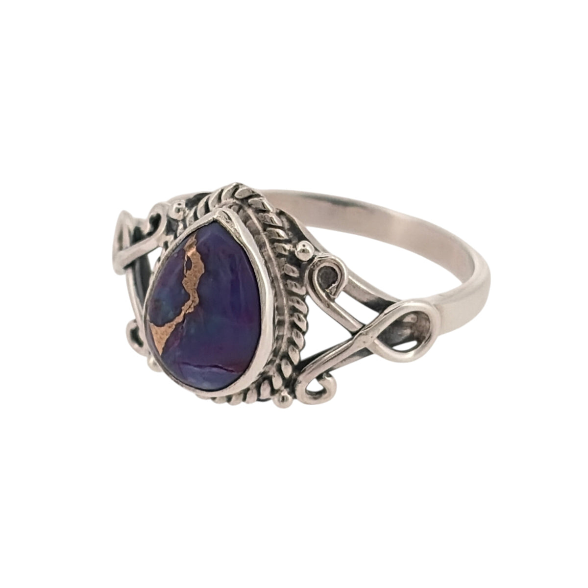 Add a colourful piece to your jewellery collection with this 925 sterling silver and purple stone teardrop ring, featuring a distinctive purple stone believed to be sugilite.

Design: The ring features a classic teardrop design, with a purple stone creating an elegant and distinctive appearance.
Material: Made from 925 sterling silver, offering a bright silver finish that complements the purple stone.