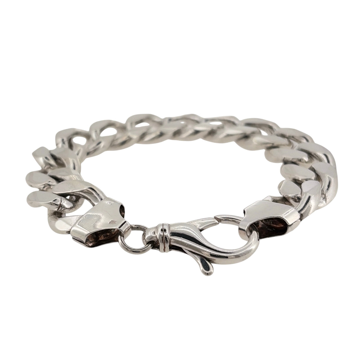 Make a statement with this pre-owned solid 925 sterling silver curb bracelet, featuring a chunky link design and an impressive weight of 97 grams.

Design: The bracelet features a classic curb link design, with substantial interlocking links creating a bold and timeless appearance.
Material: Made from solid 925 sterling silver, offering a classic silver finish.
Bracelet Detail: The curb links measure approximately 16mm wide, giving the bracelet a chunky and substantial appearance on the wrist.