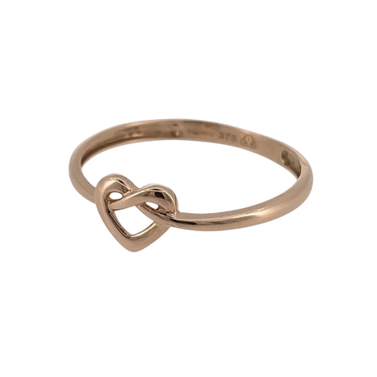 Add a meaningful piece to your jewellery collection with this pre-owned 9ct yellow gold heart knot ring, featuring a delicate heart-inspired design with decorative knot detailing.

Design: The ring features a heart knot design, symbolising love and connection, creating an elegant and timeless appearance.
Material: Made from 9ct yellow gold, offering a classic warm gold finish.
Ring Detail: The front of the ring measures approximately 7mm high, creating an attractive focal point on the finger.