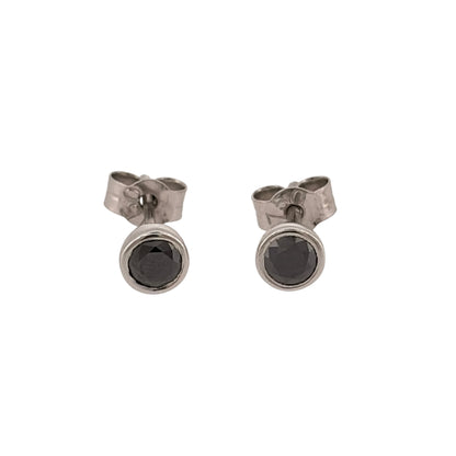 Add a sophisticated touch to your jewellery collection with these pre-owned 18ct white gold and black diamond stud earrings, featuring striking brilliant cut black diamonds in a classic stud design.

Design: The earrings feature a timeless solitaire stud design, with black diamonds creating a bold and elegant contrast against the white gold.
Material: Made from 18ct white gold, offering a classic white gold finish.