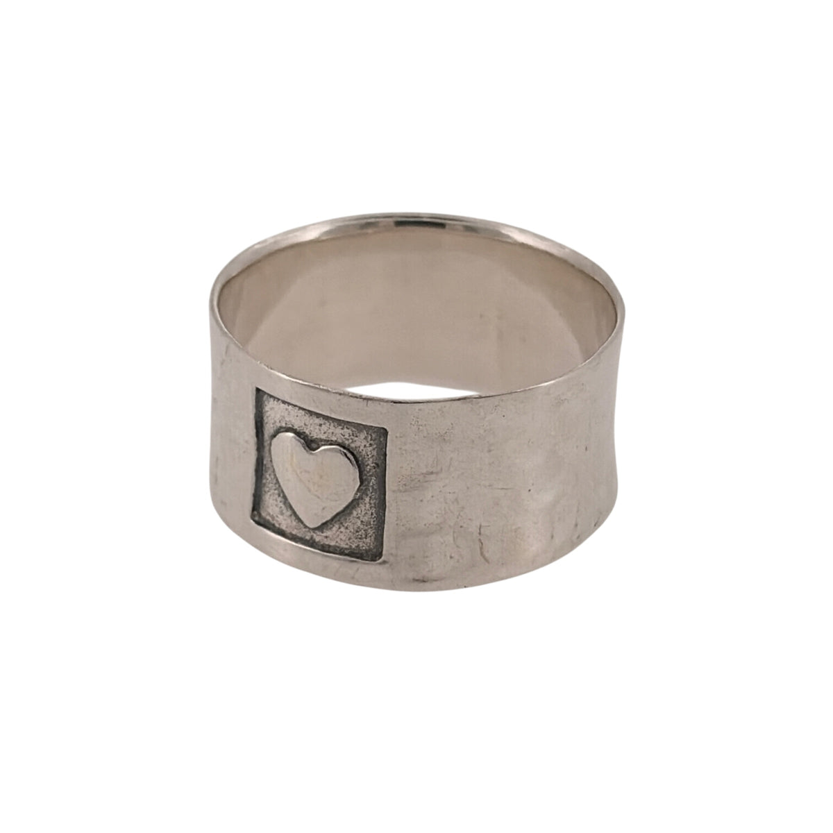 Add a charming piece to your jewellery collection with this pre-owned 925 sterling silver heart stamp textured wide band ring, featuring decorative heart detailing and a distinctive textured finish.

Design: The ring features a wide band with stamped heart motifs and textured detailing, creating an attractive and unusual appearance.
Material: Made from 925 sterling silver, offering a classic silver finish that complements the decorative design.