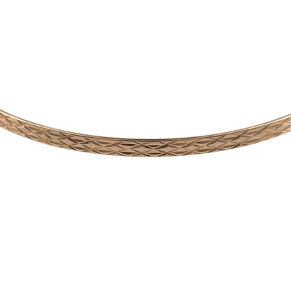 Add a classic piece to your jewellery collection with this pre-owned 9ct yellow solid gold patterned bangle, featuring decorative detailing and a timeless gold finish.

Design: The bangle features a traditional patterned design, creating an elegant and versatile appearance suitable for everyday wear.
Material: Made from solid 9ct yellow gold, offering a classic warm gold finish.