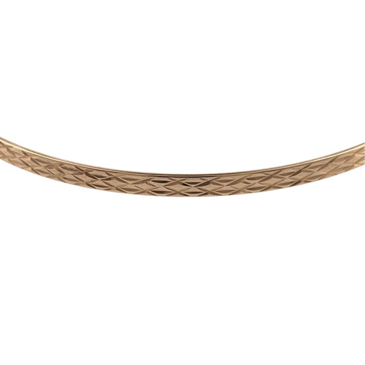 Add a classic piece to your jewellery collection with this pre-owned 9ct yellow solid gold patterned bangle, featuring decorative detailing and a timeless gold finish.

Design: The bangle features a traditional patterned design, creating an elegant and versatile appearance suitable for everyday wear.
Material: Made from solid 9ct yellow gold, offering a classic warm gold finish.