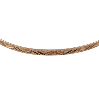 Add a classic touch to your jewellery collection with this pre-owned 9ct yellow solid gold patterned bangle, featuring decorative detailing and a timeless design.

Design: The bangle features a traditional patterned finish, adding subtle detail to its simple and elegant appearance.
Material: Made from solid 9ct yellow gold, offering a classic warm gold finish.
Bangle Detail: The bangle measures approximately 3mm wide, with a diameter of 6.7cm, creating a delicate and versatile appearance on the wrist.