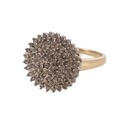 Make a statement with this pre-owned 9ct yellow gold and diamond large round cluster ring, featuring a bold circular design with decorative diamond detailing.

Design: The ring features a traditional round cluster design, with diamonds arranged to create a prominent and eye-catching appearance.
Material: Made from 9ct yellow gold, offering a classic warm gold finish.
Diamond Detail: Features diamonds set within the large round cluster, adding an elegant finishing touch to the design.