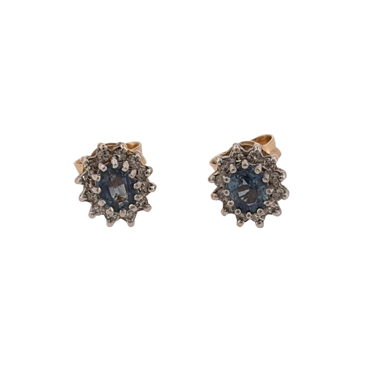 Add a classic touch of colour to your jewellery collection with these pre-owned 9ct yellow gold diamond and sapphire cluster stud earrings, featuring beautiful oval sapphires complemented by diamond detailing.

Design: The earrings feature a traditional cluster design, with oval sapphire stones surrounded by diamonds, creating an elegant and timeless appearance.
Material: Made from 9ct yellow gold, offering a warm gold finish that complements the blue sapphires.