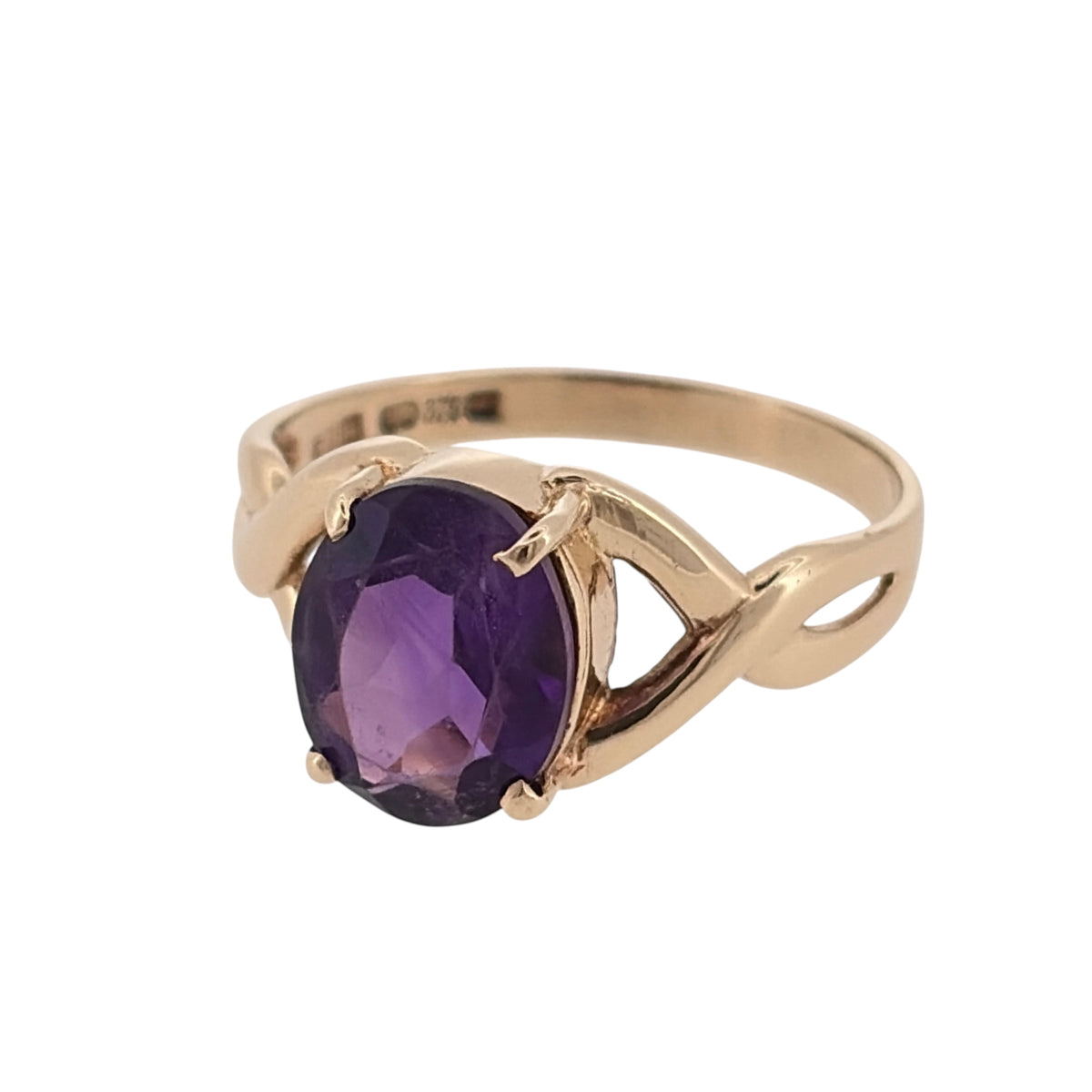 Add a colourful and elegant piece to your jewellery collection with this pre-owned 9ct yellow gold and amethyst ring, featuring a beautiful oval amethyst stone complemented by decorative twisted shoulders.

Design: The ring features a classic oval gemstone design, with twisted shoulder detailing creating an attractive and distinctive appearance.
Material: Made from 9ct yellow gold, offering a traditional warm gold finish that complements the purple tones of the amethyst.