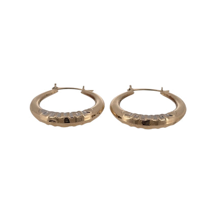 Add a meaningful touch to your jewellery collection with these pre-owned 9ct yellow and white gold Mum hoop creole earrings, featuring a decorative two-tone design with the word 'Mum' incorporated into each hoop.

Design: The earrings feature a classic round creole hoop design with 'Mum' lettering, combining yellow and white gold for an attractive two-tone appearance.
Material: Made from 9ct yellow and white gold, offering a combination of warm and contrasting gold tones.