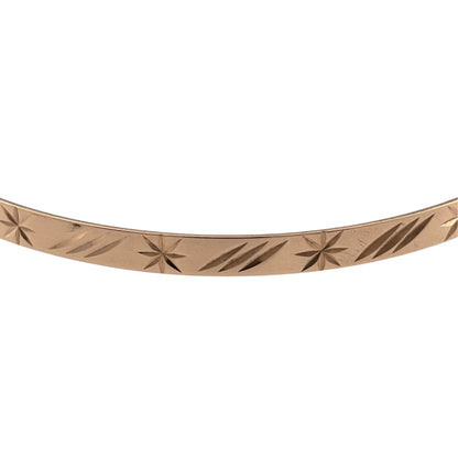 Add a timeless piece to your jewellery collection with this pre-owned 9ct yellow solid gold patterned bangle, featuring decorative detailing and a classic gold finish.

Design: The bangle features a traditional circular design with patterned detailing, creating an attractive and elegant appearance.
Material: Made from solid 9ct yellow gold, offering a classic warm gold finish.
Bangle Detail: The bangle measures approximately 4mm wide, with decorative patterned detailing that adds character to the design.