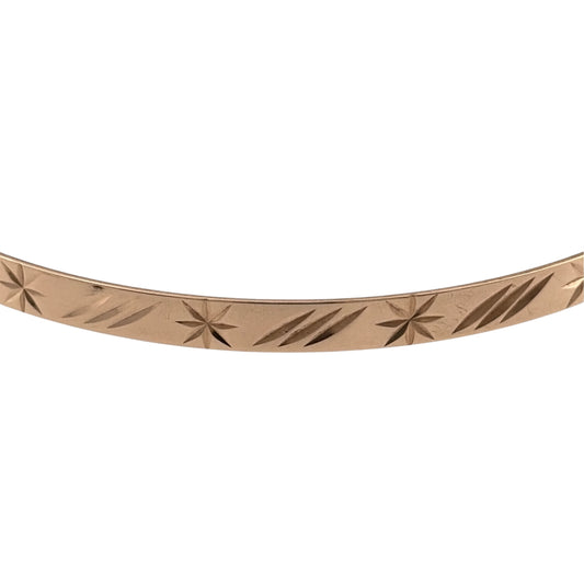 Add a timeless piece to your jewellery collection with this pre-owned 9ct yellow solid gold patterned bangle, featuring decorative detailing and a classic gold finish.

Design: The bangle features a traditional circular design with patterned detailing, creating an attractive and elegant appearance.
Material: Made from solid 9ct yellow gold, offering a classic warm gold finish.
Bangle Detail: The bangle measures approximately 4mm wide, with decorative patterned detailing that adds character to the design.