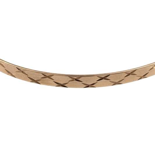 Add a timeless piece to your jewellery collection with this pre-owned 9ct yellow solid gold patterned bangle, featuring decorative detailing and a classic gold finish.

Design: The bangle features a traditional circular design with patterned detailing, creating an attractive and elegant appearance.
Material: Made from solid 9ct yellow gold, offering a classic warm gold finish.
Bangle Detail: The bangle measures approximately 4mm wide, with decorative patterned detailing that adds character to the design.
