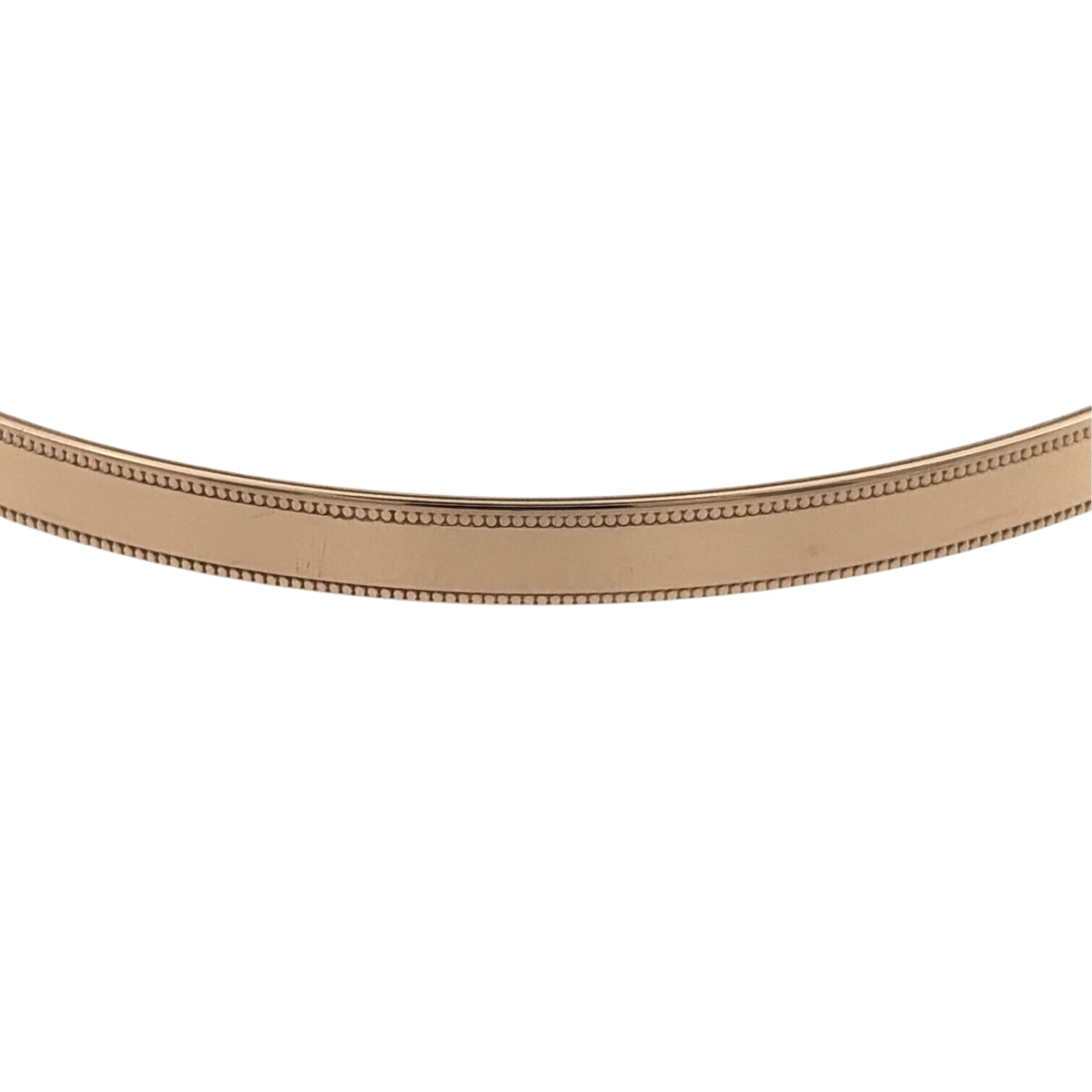 Add a classic piece to your jewellery collection with this pre-owned 9ct yellow solid gold milgrain edge bangle, featuring delicate decorative edging and a timeless gold finish.

Design: The bangle features a traditional circular design with milgrain detailing along the edges, creating an elegant and decorative appearance.
Material: Made from solid 9ct yellow gold, offering a classic warm gold finish.