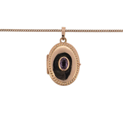 Add a sentimental touch to your jewellery collection with this pre-owned 9ct yellow gold and amethyst oval locket necklace, featuring a beautiful oval locket with an amethyst stone, suspended from an 18-inch curb chain.

Design: The necklace features a classic oval locket pendant with amethyst detailing, creating an elegant and timeless appearance.
Material: Made from 9ct yellow gold, offering a traditional warm gold finish that complements the purple tones of the amethyst.