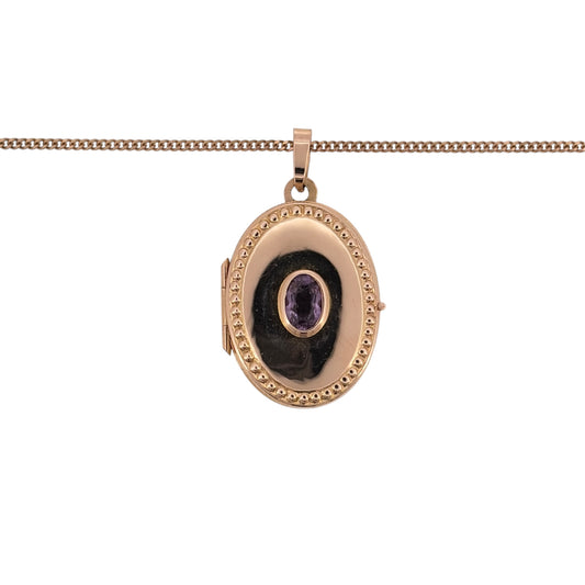 Add a sentimental touch to your jewellery collection with this pre-owned 9ct yellow gold and amethyst oval locket necklace, featuring a beautiful oval locket with an amethyst stone, suspended from an 18-inch curb chain.

Design: The necklace features a classic oval locket pendant with amethyst detailing, creating an elegant and timeless appearance.
Material: Made from 9ct yellow gold, offering a traditional warm gold finish that complements the purple tones of the amethyst.