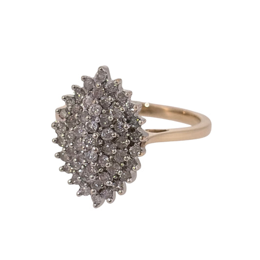 Add an elegant statement piece to your jewellery collection with this pre-owned 9ct yellow gold and diamond marquise cluster ring, featuring an eye-catching design with approximately 0.85ct of diamonds in total.

Design: The ring features a distinctive marquise-shaped cluster design, with diamonds arranged to create an elegant and prominent appearance.
Material: Made from 9ct yellow gold, offering a classic warm gold finish that complements the diamonds.