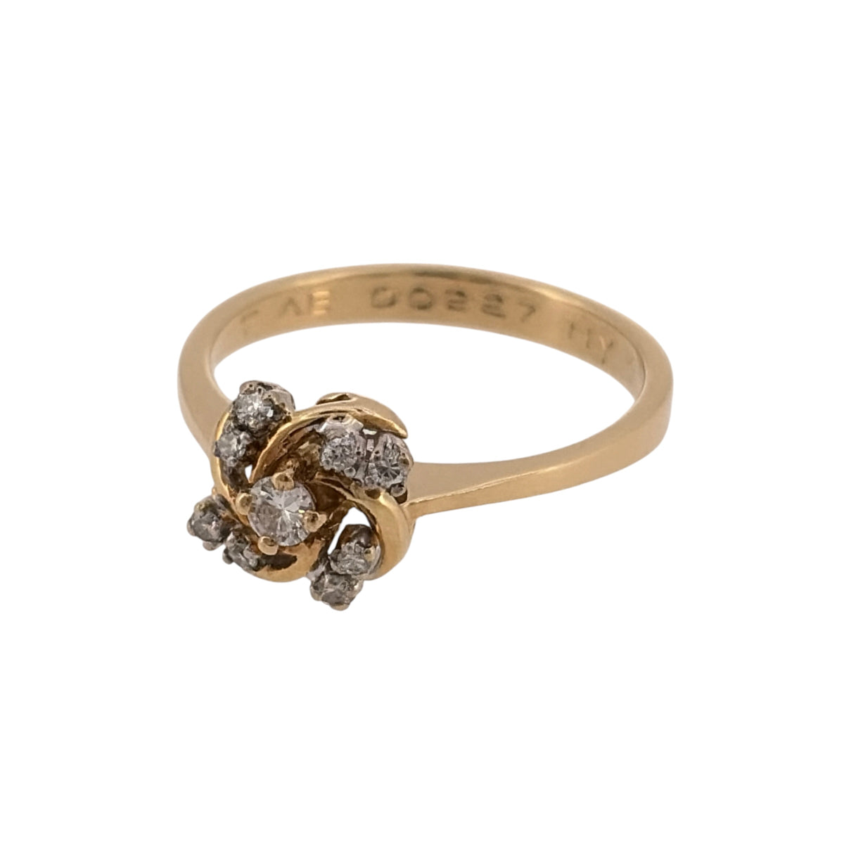 Add an elegant touch to your jewellery collection with this pre-owned 18ct yellow gold and diamond swirl cluster ring, featuring a decorative swirling design complemented by diamond detailing.

Design: The ring features a distinctive swirl cluster design, with diamonds arranged to create an attractive and elegant appearance.
Material: Made from 18ct yellow gold, offering a classic warm gold finish that complements the diamonds.