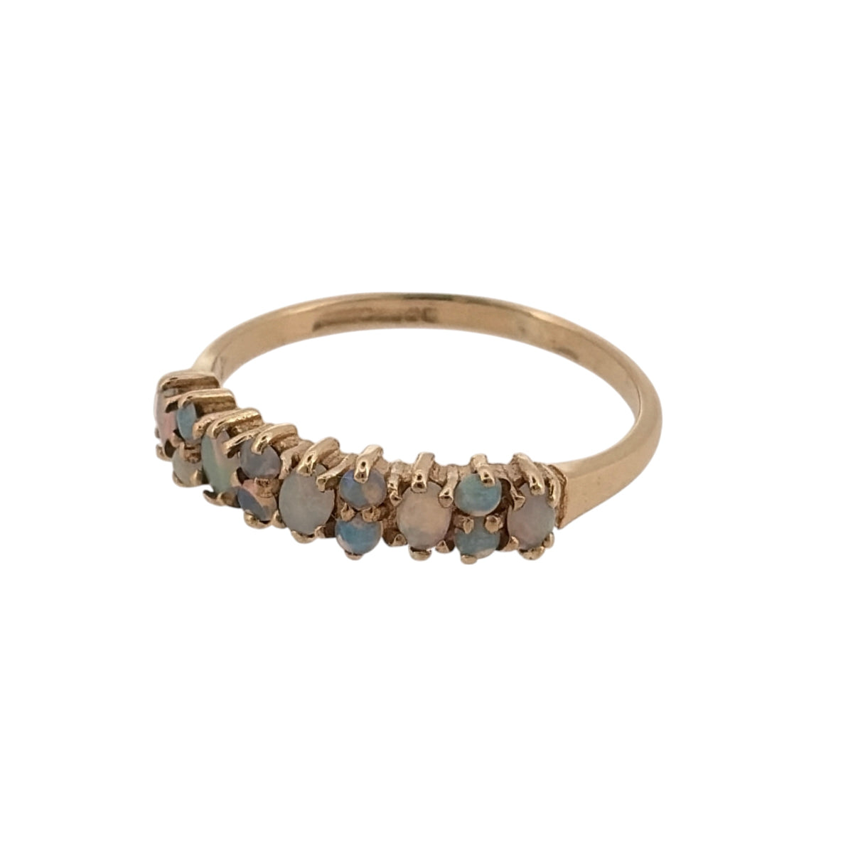 Add a delicate touch of colour to your jewellery collection with this pre-owned 9ct yellow gold and opalique cluster band ring, featuring decorative opalique stones in a classic gold design.

Design: The ring features a traditional cluster band design, with opalique stones arranged across the front to create an attractive and elegant appearance.
Material: Made from 9ct yellow gold, offering a classic warm gold finish that complements the colourful tones of the opalique stones.