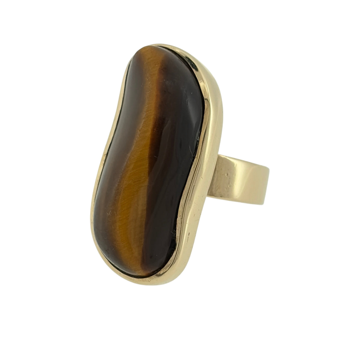 Add a distinctive statement piece to your jewellery collection with this pre-owned 9ct yellow gold and tiger's eye dress ring, featuring a large tiger's eye stone in a classic gold design.

Design: The ring features an eye-catching dress ring design, with a prominent tiger's eye stone creating a bold and elegant appearance.
Material: Made from 9ct yellow gold, offering a traditional warm gold finish that complements the rich brown and golden tones of the tiger's eye.