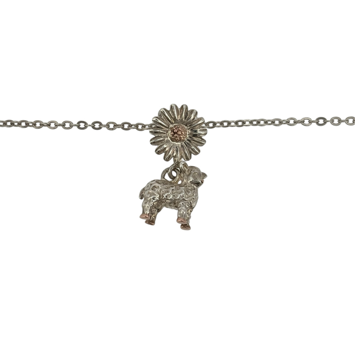 Add a charming touch to your jewellery collection with this pre-owned Clogau lamb daisy pendant necklace, combining 925 sterling silver with 9ct rose gold detailing in a delicate nature-inspired design.

Design: The necklace features a decorative lamb daisy pendant, creating an attractive and charming appearance inspired by nature.
Material: Made from 925 sterling silver with 9ct rose gold detailing, offering an elegant contrasting two-tone finish.