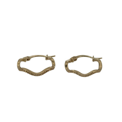 Add a stylish touch to your jewellery collection with these pre-owned 9ct yellow gold wavy hoop creole earrings, featuring a decorative wave-inspired design in a classic gold finish.

Design: The earrings feature an elegant wavy creole hoop design, with gently curved detailing creating an attractive and distinctive appearance.
Material: Made from 9ct yellow gold, offering a traditional warm gold finish that beautifully complements the flowing wave design.