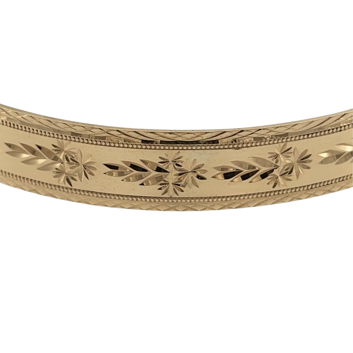 Add a timeless touch to your jewellery collection with this pre-owned 9ct solid yellow gold patterned bangle, featuring a decorative design in a classic warm gold finish.

Design: The bangle features an elegant patterned design, with decorative detailing creating an attractive and distinctive appearance.
Material: Made from solid 9ct yellow gold, offering a traditional warm gold finish that beautifully complements the patterned detailing.