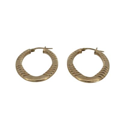 Add an elegant touch to your jewellery collection with these pre-owned 9ct yellow gold textured oval creole earrings, featuring a decorative textured finish in a classic gold design.

Design: The earrings feature a stylish oval creole design, with textured detailing creating an attractive and distinctive appearance.
Material: Made from 9ct yellow gold, offering a traditional warm gold finish that beautifully complements the decorative texture.