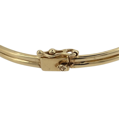 Add a touch of Welsh heritage and timeless elegance to your jewellery collection with this pre-owned 9ct yellow and rose gold Clogau hinged Vine/Tree of Life bangle, featuring a beautifully detailed design with meaningful everyday appeal—perfect for gifting, special occasions, or treasured daily wear.

Design: The bangle showcases an elegant Vine and Tree of Life inspired design measuring approximately 11mm high at the front.
