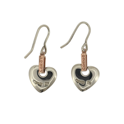 Add a meaningful touch to your jewellery collection with these pre-owned 925 sterling silver and 9ct rose gold Cariad heart drop earrings, featuring a romantic Welsh-inspired design in an elegant two-tone finish.

Design: The earrings feature a beautiful heart-shaped drop design incorporating the Welsh word 'Cariad', meaning love, creating a sentimental and distinctive appearance.