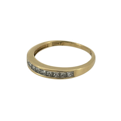 Add an elegant touch to your jewellery collection with this pre-owned 18ct yellow gold and diamond band ring, featuring beautiful princess cut diamonds set across the front of the band for a classic and timeless appearance.

Design: The ring features a traditional diamond-set band design, combining the clean lines of princess cut diamonds with the rich yellow tone of 18ct gold for an elegant finish.
Material: Made from 18ct yellow gold, offering a beautiful warm gold finish that complements the diamonds.