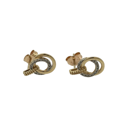 Add an elegant touch to your jewellery collection with these pre-owned 9ct yellow gold and diamond double circle stud earrings, featuring a decorative circular design complemented by delicate diamond detailing.

Design: The earrings feature a distinctive double circle design, combining elegant gold detailing with diamonds for a classic and contemporary appearance.
Material: Made from 9ct yellow gold, offering a beautiful warm gold finish that complements the diamonds.