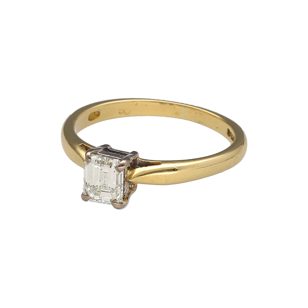 Showcasing refined elegance and exceptional diamond beauty, this pre-owned 18ct yellow gold emerald-cut diamond solitaire ring is a timeless piece that perfectly balances classic luxury with sophisticated styling. Featuring a stunning emerald-cut diamond as its focal point, this ring offers understated glamour and enduring appeal.

Design: The ring centres around a beautiful emerald-cut diamond, admired for its elegant rectangular shape and distinctive step-cut facets.