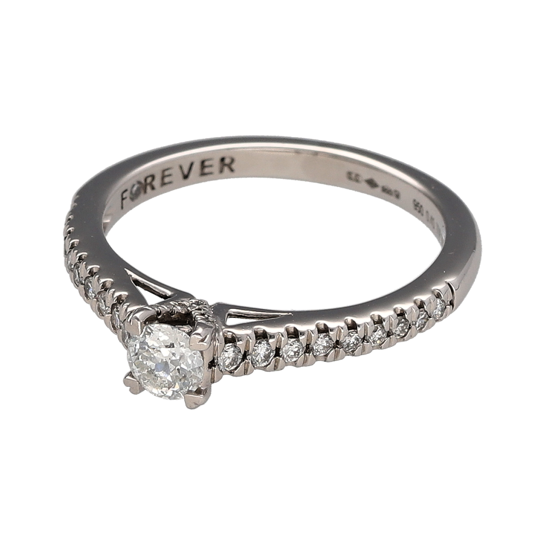Add timeless elegance and refined sparkle to your jewellery collection with this pre-owned platinum and diamond solitaire ring, featuring a brilliant cut centre diamond complemented by diamond-set shoulders.

Design: The ring showcases a classic solitaire-style design centred around a brilliant cut diamond, with additional diamonds set along the shoulders to create extra sparkle and visual interest while retaining an elegant and timeless appearance.