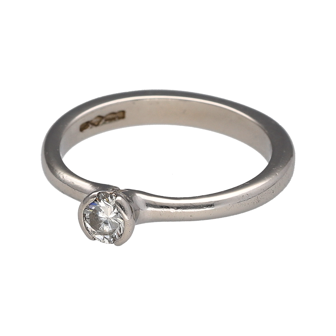 Add timeless luxury and refined brilliance to your jewellery collection with this pre-owned platinum and diamond solitaire ring, featuring a certified 0.28ct brilliant-cut diamond with E colour and SI2 clarity—perfect as a classic engagement ring, proposal ring, anniversary gift, or sophisticated piece of fine jewellery.

Design: The ring features a classic solitaire design centred with a single brilliant-cut diamond, creating an elegant and timeless appearance that allows the diamond