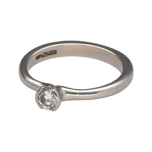 Add timeless luxury and refined brilliance to your jewellery collection with this pre-owned platinum and diamond solitaire ring, featuring a certified 0.28ct brilliant-cut diamond with E colour and SI2 clarity—perfect as a classic engagement ring, proposal ring, anniversary gift, or sophisticated piece of fine jewellery.

Design: The ring features a classic solitaire design centred with a single brilliant-cut diamond, creating an elegant and timeless appearance that allows the diamond