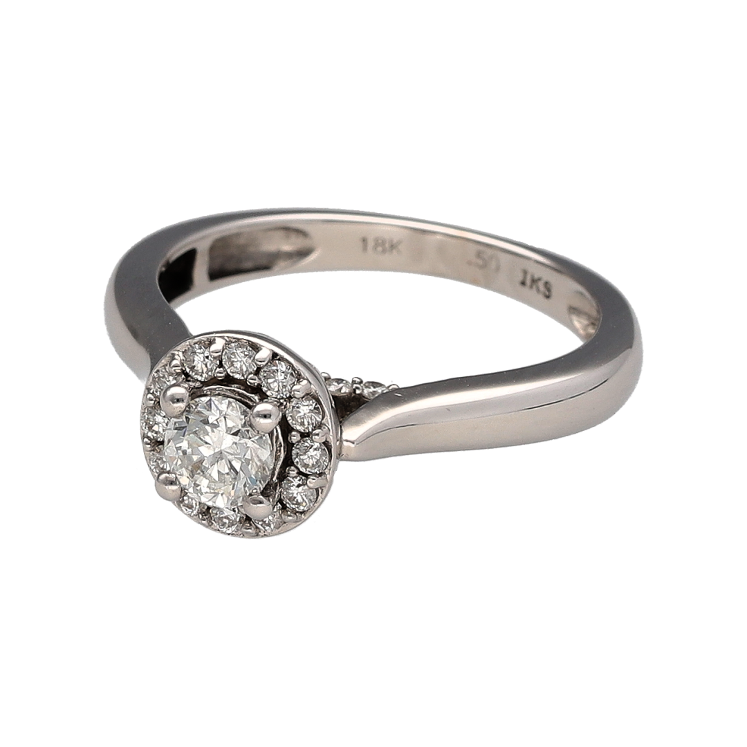 Add luxurious sparkle and sophisticated style to your jewellery collection with this pre-owned 18ct white gold and diamond halo ring, featuring an eye-catching diamond arrangement and approximately 0.50ct of total diamond content—perfect as an engagement ring, anniversary gift, statement ring, or elegant piece for special occasions.

Design: The ring features a classic halo design, with sparkling diamonds creating a striking focal point and enhancing the overall brilliance and presence of the ring.