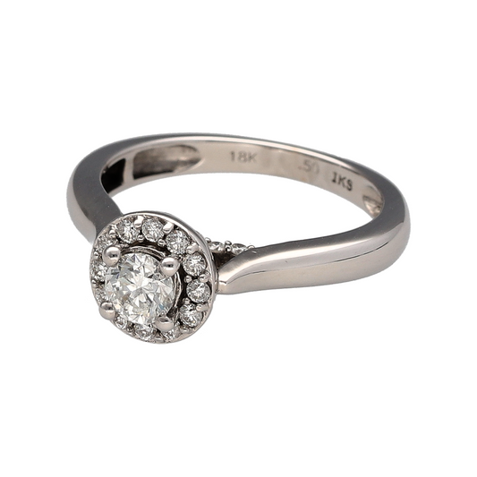Add luxurious sparkle and sophisticated style to your jewellery collection with this pre-owned 18ct white gold and diamond halo ring, featuring an eye-catching diamond arrangement and approximately 0.50ct of total diamond content—perfect as an engagement ring, anniversary gift, statement ring, or elegant piece for special occasions.

Design: The ring features a classic halo design, with sparkling diamonds creating a striking focal point and enhancing the overall brilliance and presence of the ring.