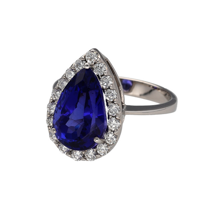 Make a statement with this stunning pre-owned 18ct white gold diamond and tanzanite teardrop cluster ring. Showcasing a striking pear-shaped tanzanite surrounded by sparkling diamonds, this elegant ring is a beautiful choice for anyone who loves vibrant coloured gemstones. Tanzanite is also the birthstone for December, making it an ideal gift for a December birthday.
