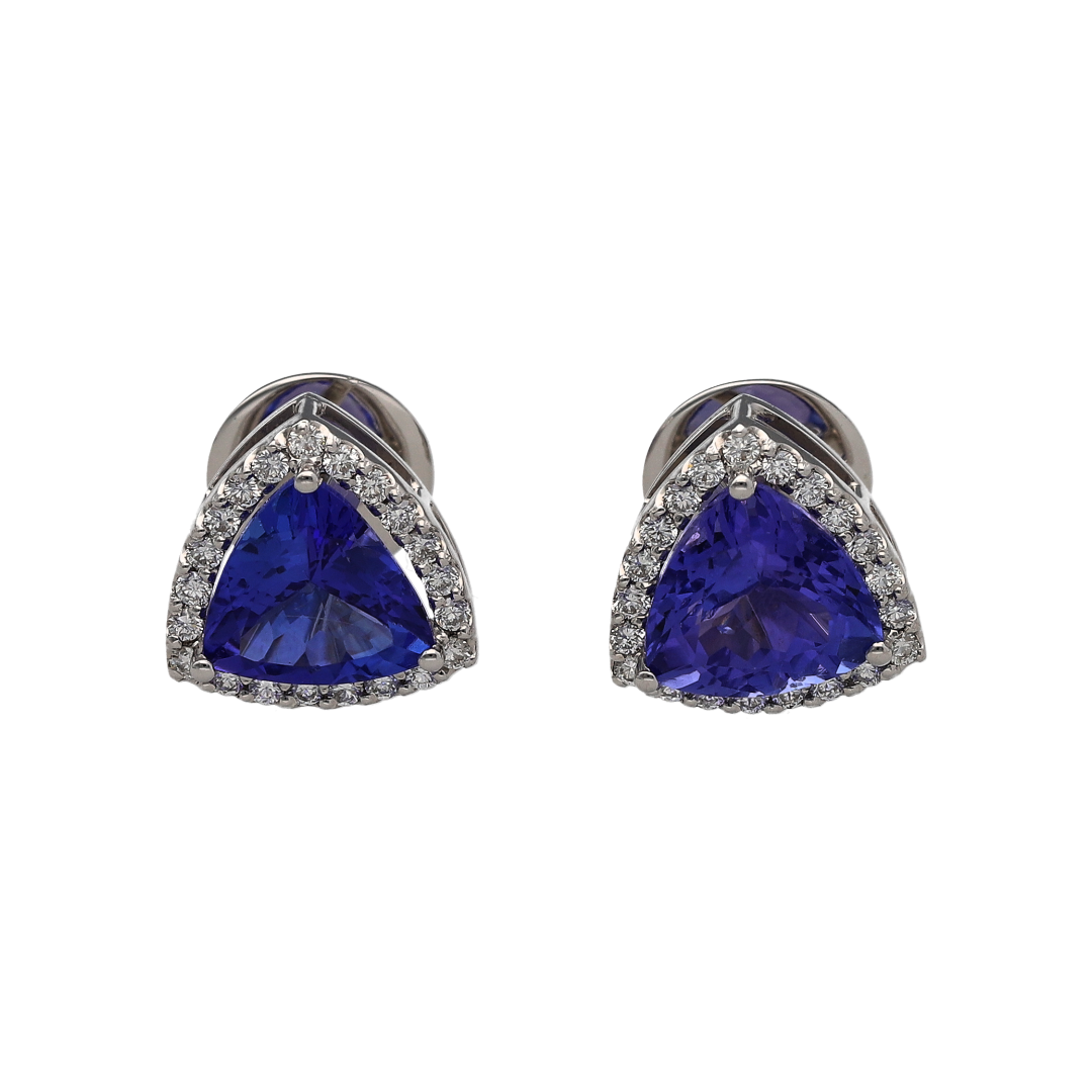 Add a splash of colour to your jewellery collection with these stunning pre-owned 18ct white gold diamond and tanzanite cluster stud earrings. Featuring vibrant triangular tanzanite gemstones surrounded by sparkling diamonds, these elegant studs are perfect for everyday wear or special occasions. Tanzanite is also the birthstone for December, making these earrings a thoughtful gift for a December birthday.