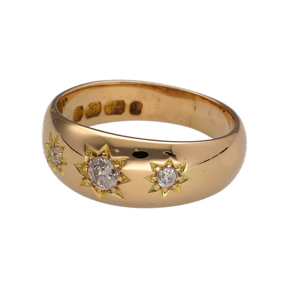 This pre-owned 18ct yellow gold diamond vintage-style trilogy band ring is a distinctive design, featuring three brilliant cut diamonds in decorative starburst settings.

Design: Featuring a vintage-style trilogy design, this ring has three brilliant cut diamonds individually set within starburst-style settings across the front.
Material: Made from 18-carat yellow gold.
Gemstone Detail: Set with three brilliant cut diamonds in starburst-style settings.