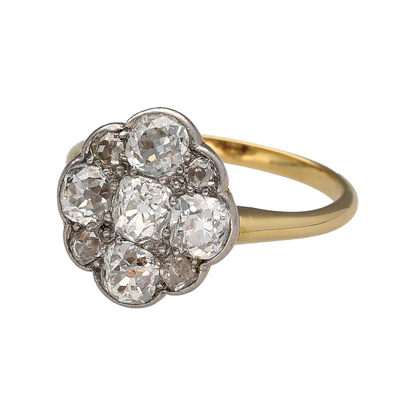 This pre-owned 18ct yellow gold diamond oval cluster ring is a beautiful traditional design, featuring multiple round old cut diamonds arranged in an oval-shaped cluster.

Design: Featuring a classic oval cluster design, this ring showcases multiple old cut diamonds set together for a distinctive traditional appearance.
Material: Made from 18-carat yellow gold.
Gemstone Detail: Set with multiple round old cut diamonds with approximately 1.15ct of diamond content in total.