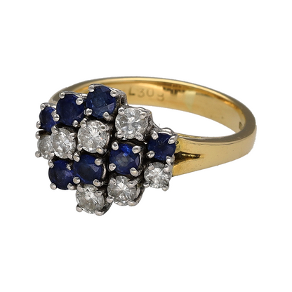 This pre-owned 18ct yellow gold diamond and sapphire cluster ring is a striking design, featuring alternating rows of diamonds and sapphires across the front.

Design: Featuring a bold cluster design, this ring combines two rows of diamonds with two rows of sapphires for a distinctive multi-row appearance in warm 18ct yellow gold.
Material: Made from 18-carat yellow gold.
Gemstone Detail: Set with two rows of diamonds and two rows of sapphires across the cluster design.