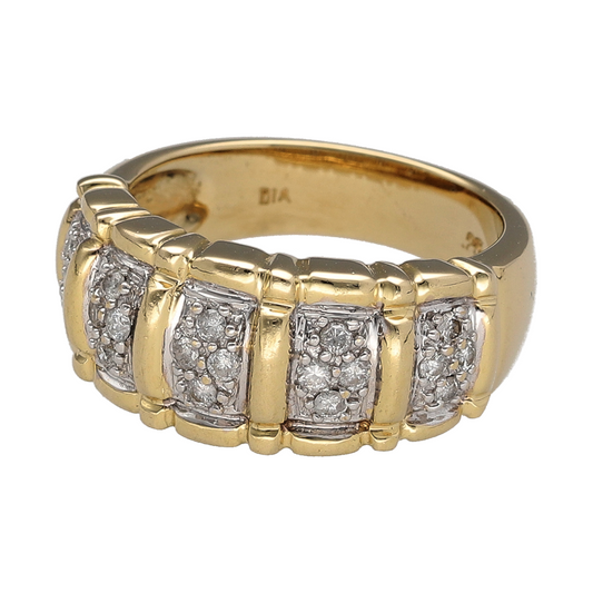 This pre-owned 14ct yellow and white gold diamond wide cluster band ring is a bold two-tone design, featuring diamond detailing across the front of the band.

Design: Featuring a wide cluster-style band design, this ring combines warm yellow gold with contrasting white gold and diamond detailing for a distinctive two-tone appearance.
Material: Made from 14-carat yellow and white gold.
Gemstone Detail: Set with multiple diamonds across the cluster-style design.