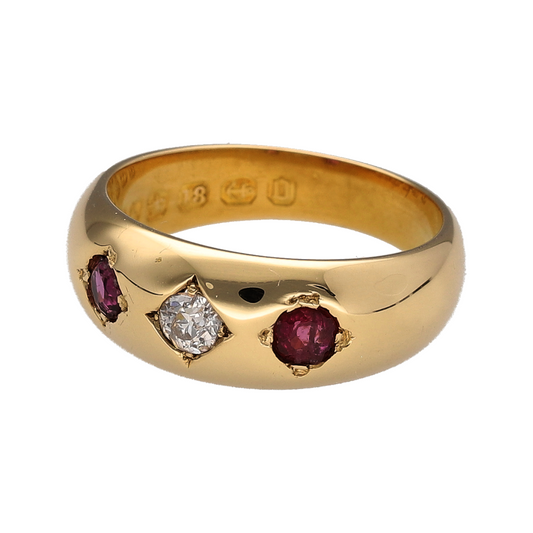 This pre-owned 18ct yellow gold diamond and ruby vintage-style band ring is a traditional design, featuring a central diamond with a ruby set on either side.

Design: Featuring a vintage-style three stone design, this ring has a diamond at the centre with a ruby on either side, finished in warm 18ct yellow gold.
Material: Made from 18-carat yellow gold.
Gemstone Detail: Set with a central diamond complemented by two rubies, with one set on either side.
